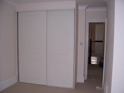 white bespoke wardrobe with sliding doors