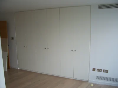 white wardrobe with hinged doors