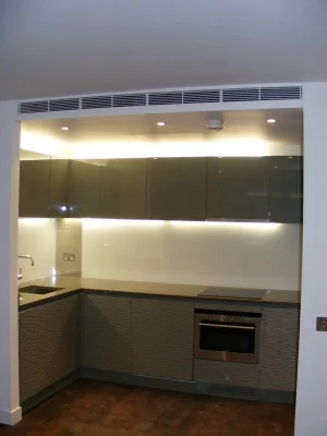 small modern kitchen with oven and induction cooker