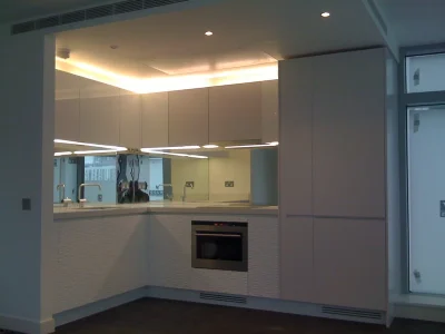 white open built kitchen with modern lighting