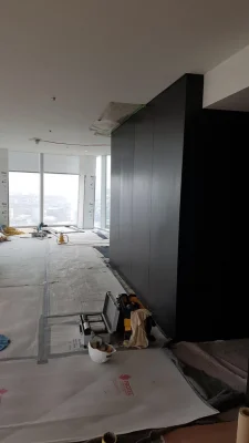 flat during renovation with black bespoke wardrobe