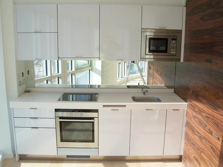 bespoke kitchen with mirrors, microwave and oven